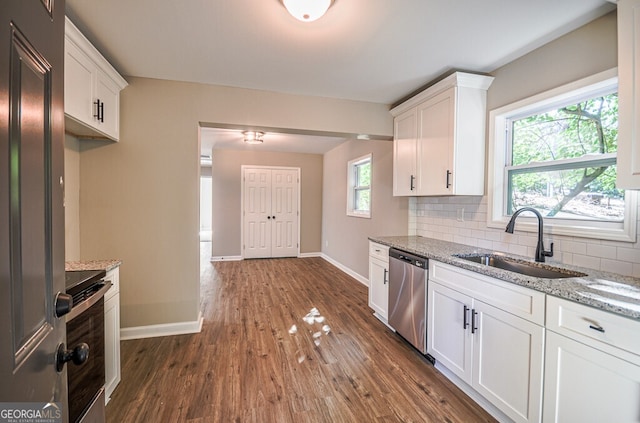 kitchen featuring white cabinets, sink, and stainless steel dishwasher