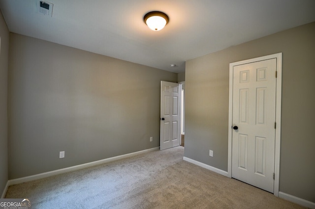 unfurnished bedroom with light carpet