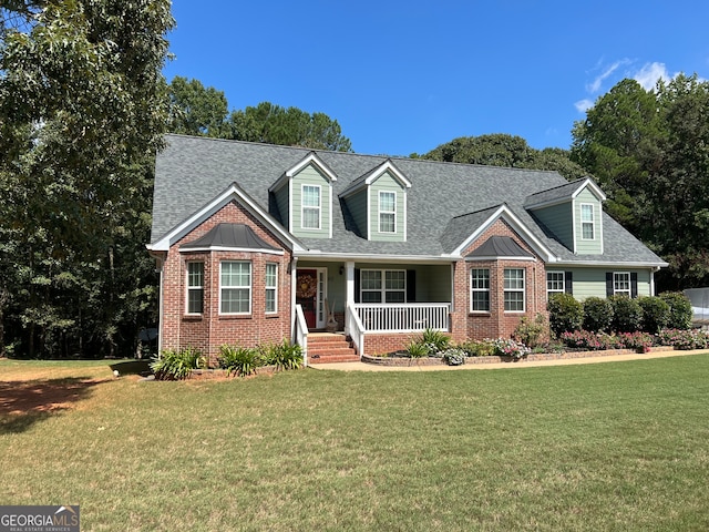 cape cod house with a porch and a front lawn