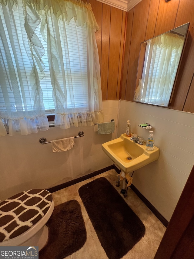 bathroom with sink, toilet, and tile patterned floors