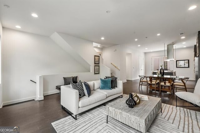 living room featuring dark hardwood / wood-style flooring