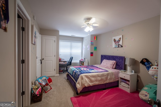 bedroom with ceiling fan and light colored carpet