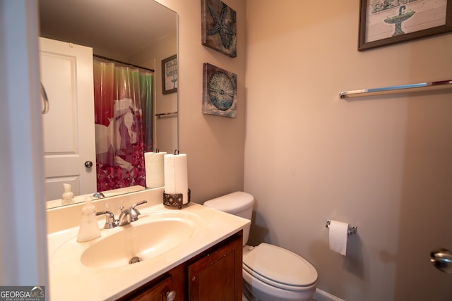 bathroom with vanity and toilet