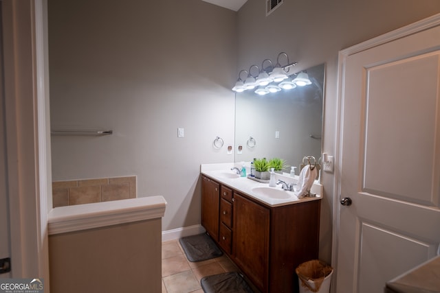 bathroom featuring tile patterned flooring and vanity