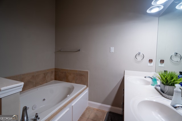 bathroom featuring a tub, vanity, and tile patterned floors