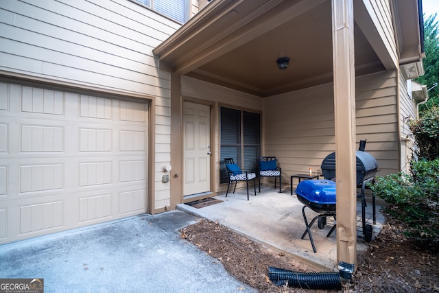 view of exterior entry with a garage