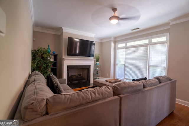 living room with ceiling fan, ornamental molding, and dark hardwood / wood-style flooring