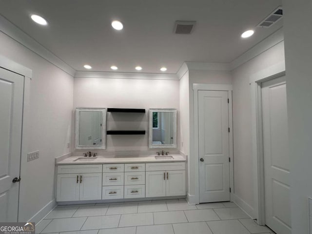 bathroom with vanity, ornamental molding, and tile patterned floors