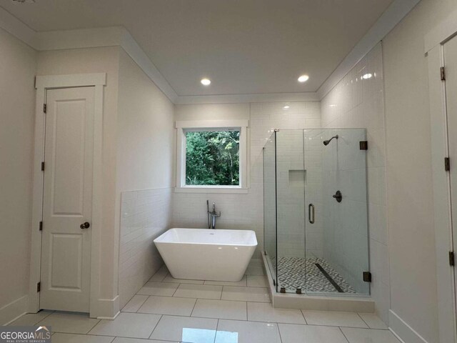 bathroom featuring ornamental molding, tile patterned floors, and separate shower and tub