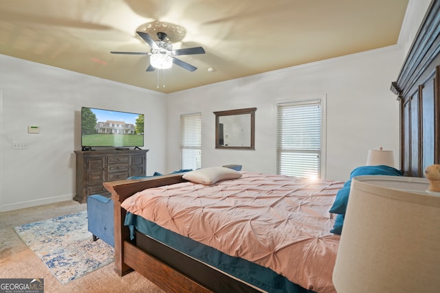 bedroom featuring carpet floors, crown molding, and ceiling fan