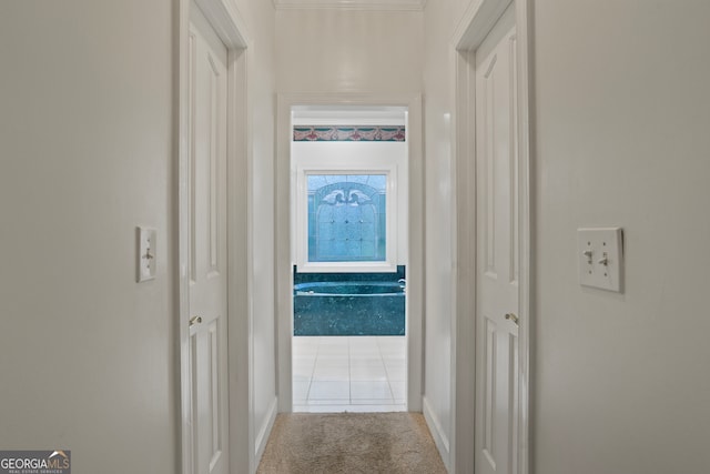 corridor with light tile patterned flooring