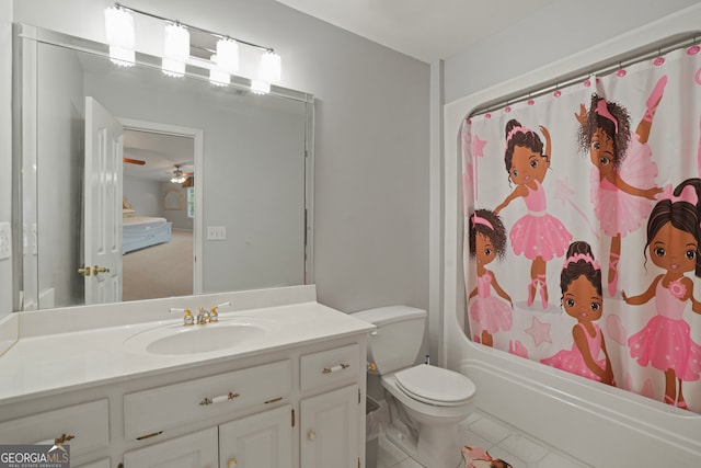 full bathroom with tile patterned flooring, shower / bath combo with shower curtain, ceiling fan, vanity, and toilet