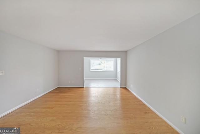 spare room featuring light hardwood / wood-style flooring