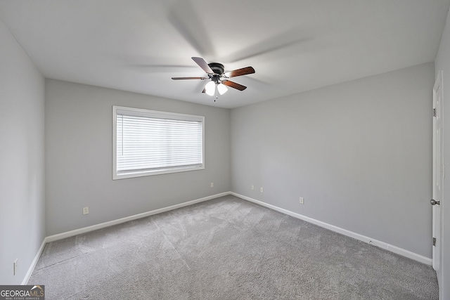 unfurnished room featuring carpet and ceiling fan