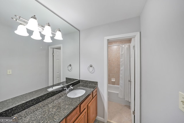 bathroom featuring tile patterned flooring, vanity, and shower / bathtub combination with curtain