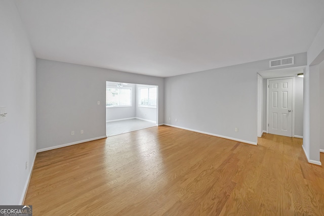 unfurnished room featuring light hardwood / wood-style floors