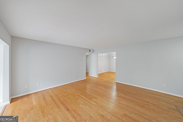 unfurnished room featuring light hardwood / wood-style flooring