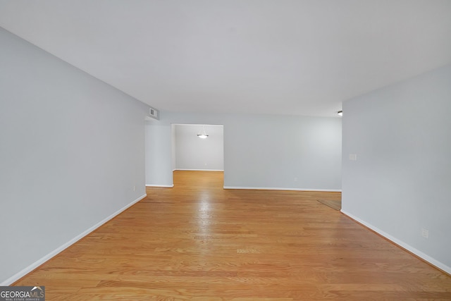 unfurnished room featuring light hardwood / wood-style floors