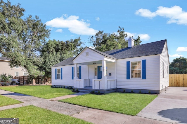 bungalow-style home featuring a porch and a front yard