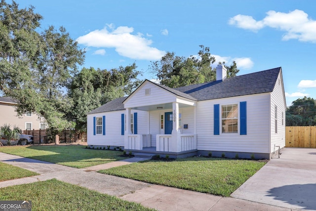 bungalow featuring a front yard and a porch