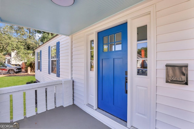 entrance to property featuring a porch