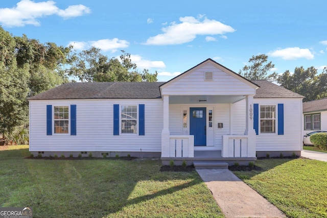 view of front of house with a porch and a front lawn