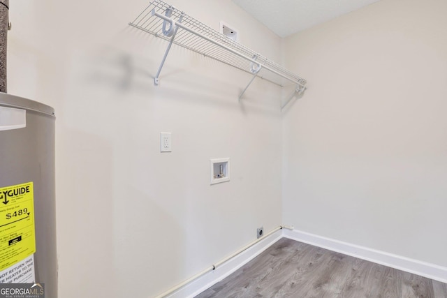 laundry room with washer hookup and wood-type flooring