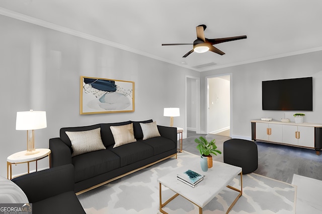 living room featuring hardwood / wood-style floors, ceiling fan, and crown molding