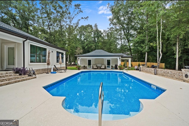 view of swimming pool featuring a patio area