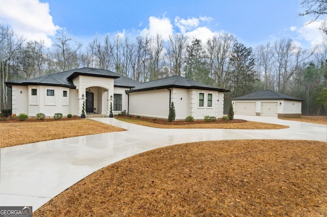 view of front of home featuring an outbuilding and a garage