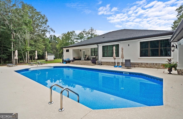 view of pool featuring a patio area