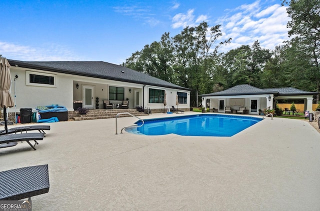 view of pool featuring an outdoor living space and a patio