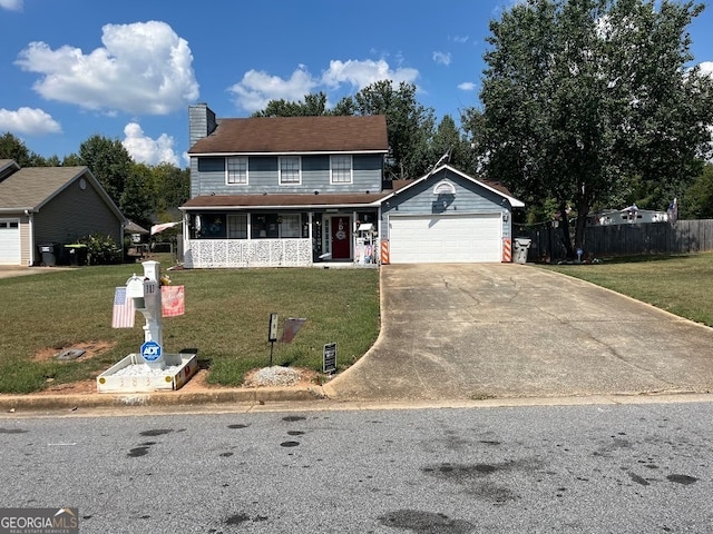 view of front of house with a front yard and a garage