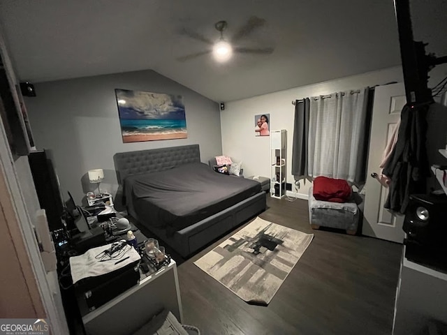 bedroom featuring vaulted ceiling, dark wood-type flooring, and ceiling fan