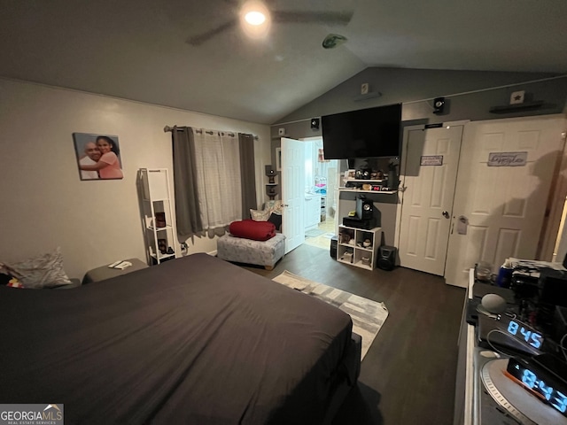 bedroom with vaulted ceiling, dark hardwood / wood-style floors, and ceiling fan