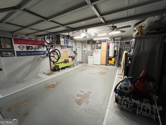 garage featuring ceiling fan, a garage door opener, and white fridge