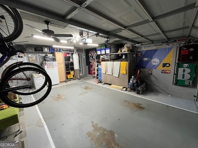 garage featuring a garage door opener and ceiling fan