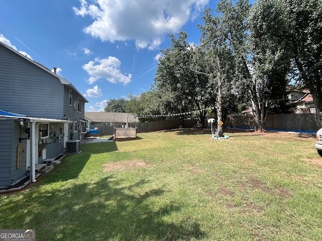 view of yard featuring central AC