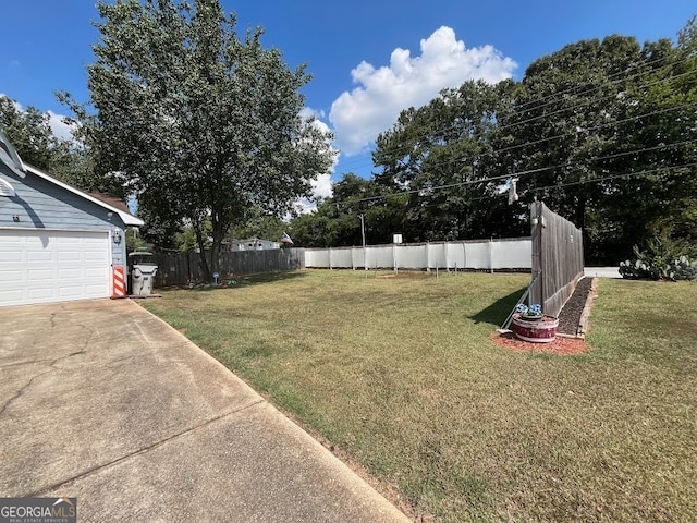 view of yard featuring a garage