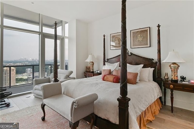 3630 Peachtree Rd Unit Ph3302, Atlanta, GA 30326 - bedroom featuring wood finished floors and expansive windows