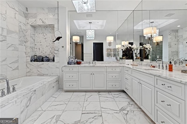 3630 Peachtree Rd Unit Ph3302, Atlanta, GA 30326 - bathroom with marble look tile flooring, vanity, a bath, and a shower