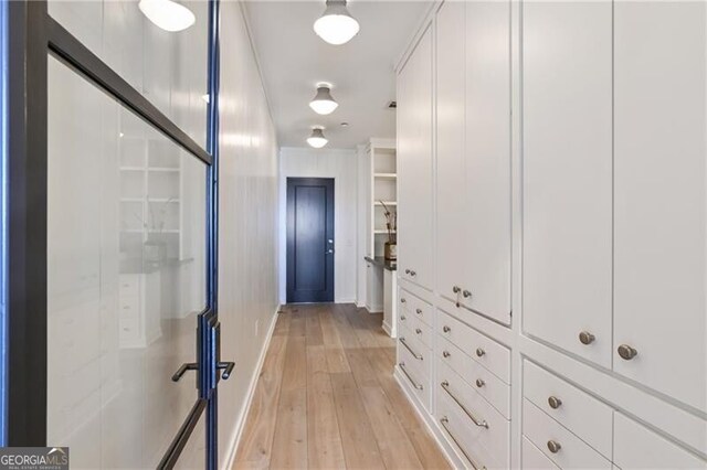 hallway featuring light hardwood / wood-style floors