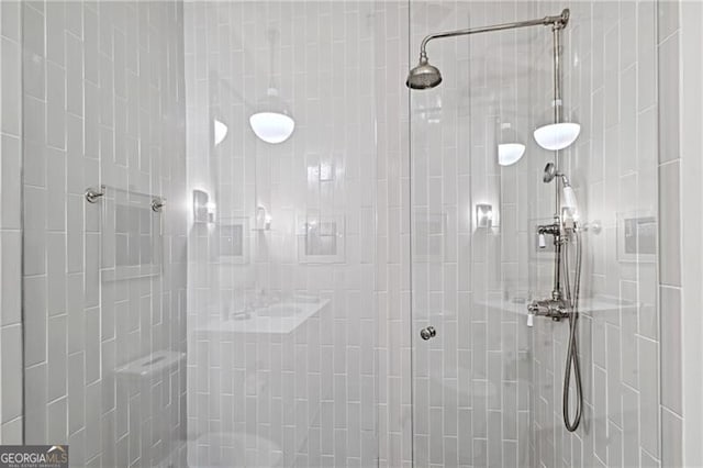 bathroom with tiled shower