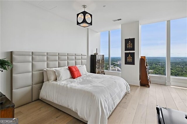 bedroom with light wood-type flooring