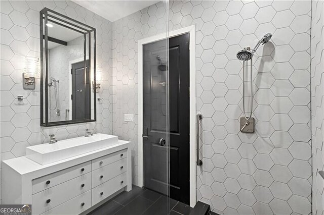 bathroom with tile walls, tile patterned floors, and vanity