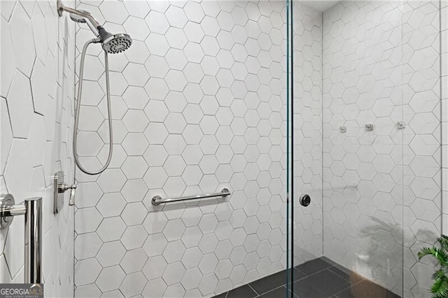 bathroom with tile patterned floors and an enclosed shower