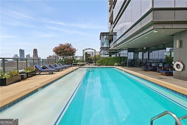 view of swimming pool with a patio area