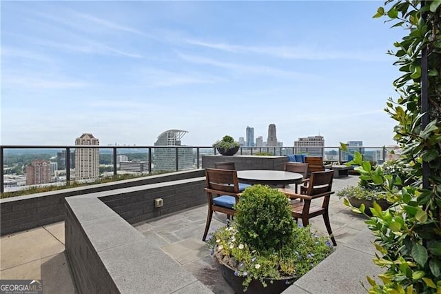 3630 Peachtree Rd Unit Ph3302, Atlanta, GA 30326 - view of patio with a skyline view and outdoor dining area