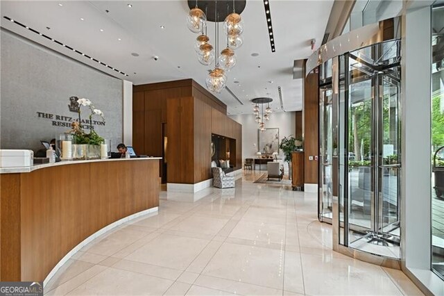 welcome area with a notable chandelier