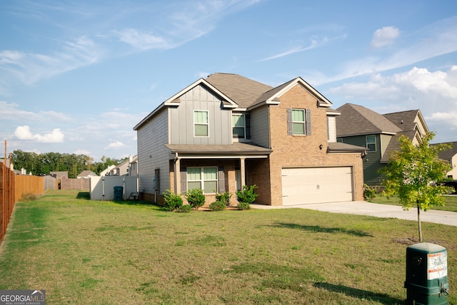 view of front of home featuring a front yard and a garage